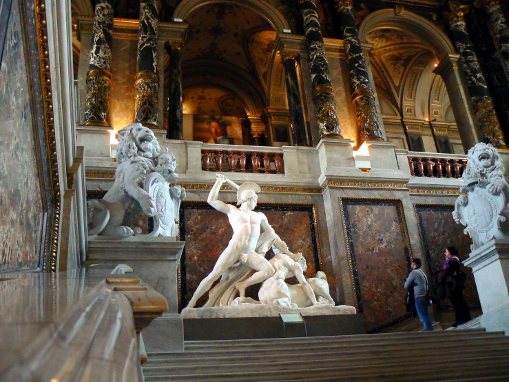 some statues of some sort inside of an old building