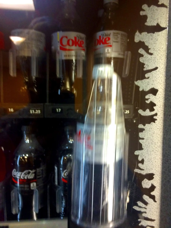 a counter with several soda bottles on it