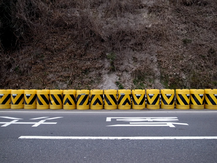 some yellow signs that are by some road