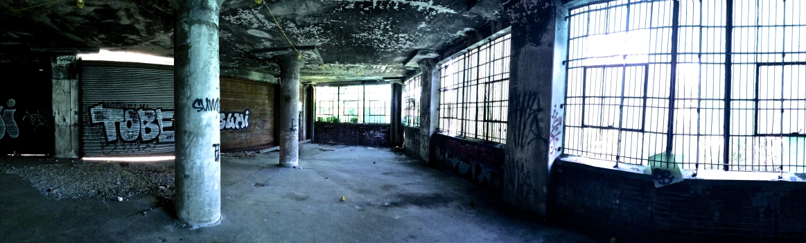 the interior of an abandoned building with windows