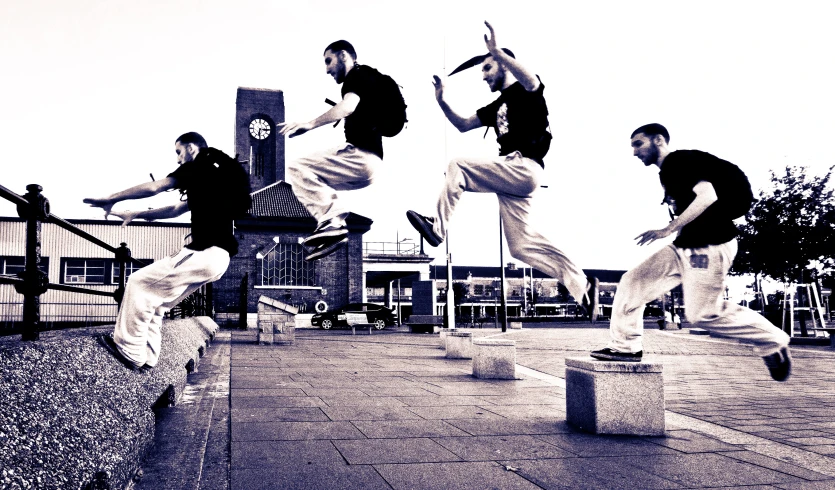 three men jumping in the air on skateboards