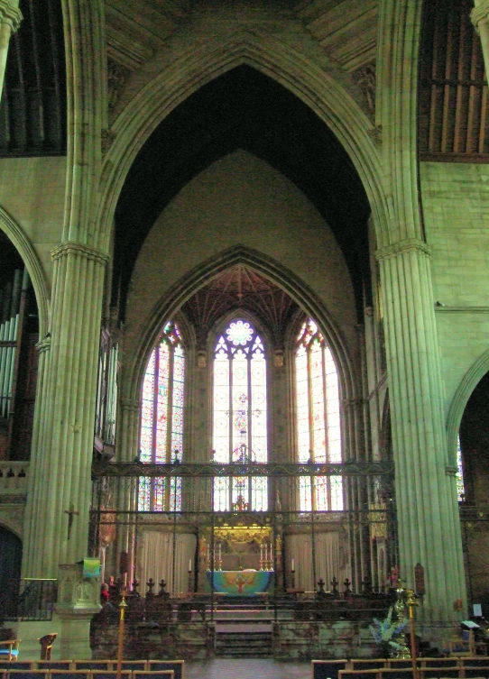 a church with pews and stained glass windows