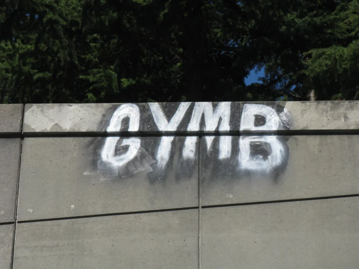 graffiti that reads ovmb on a concrete wall