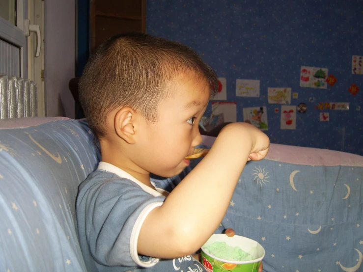 a  in a room brushing his teeth