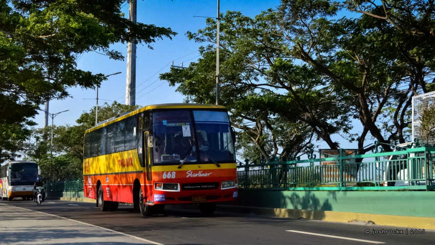 a bus on the street is parked and waiting for customers to board