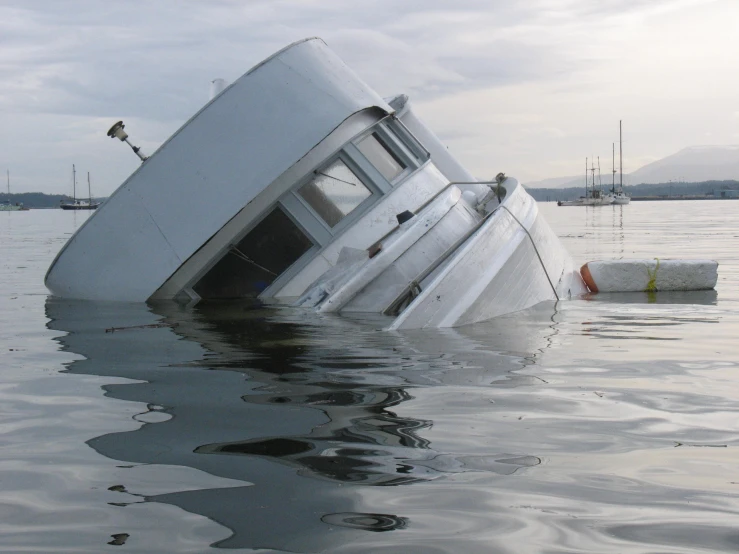 a large white boat floating in a body of water