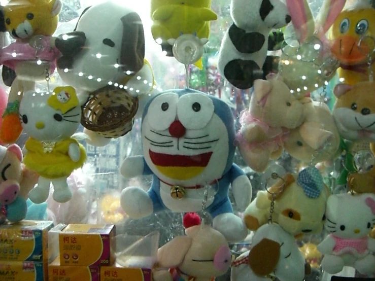 stuffed toys are shown in a shop window