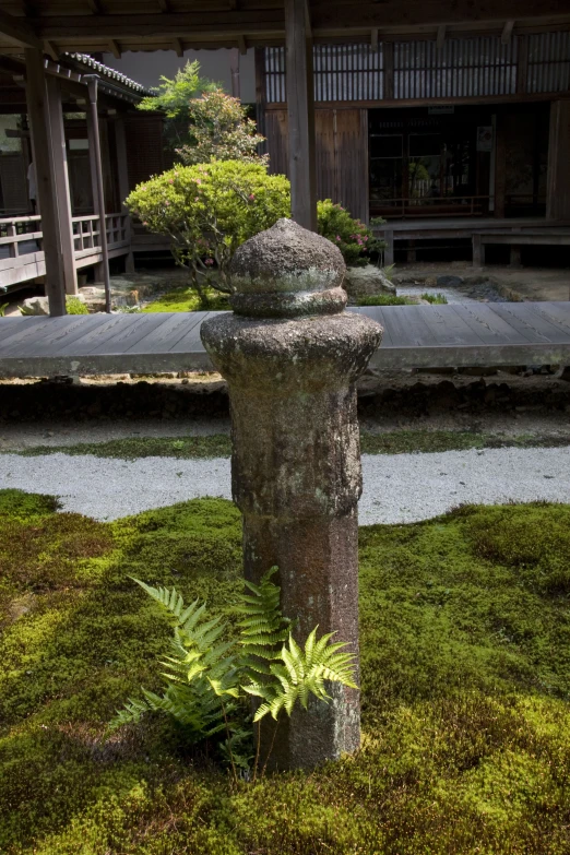 this is a large stone statue in a garden