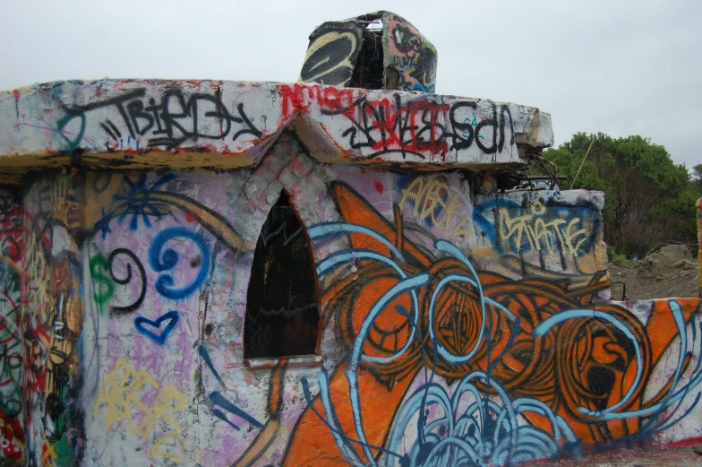 a building with graffiti on the roof