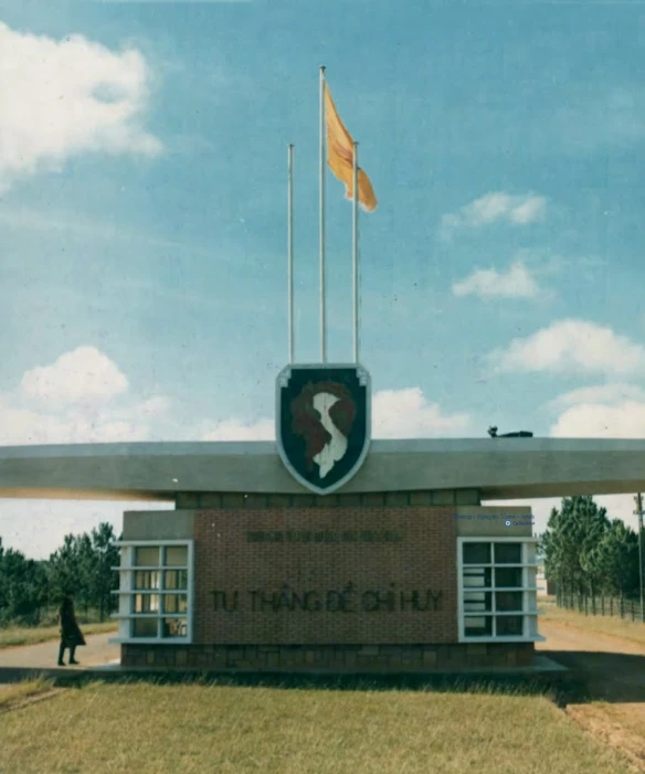 there is a flag in front of the large building