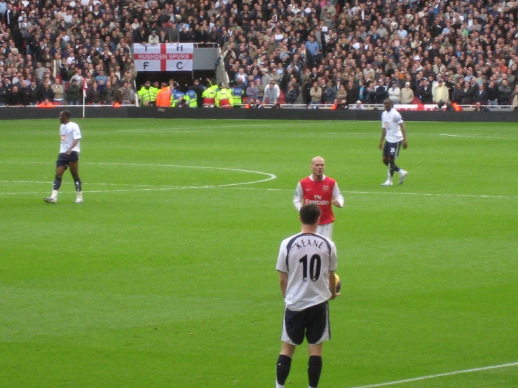 a soccer player and two other players in the field