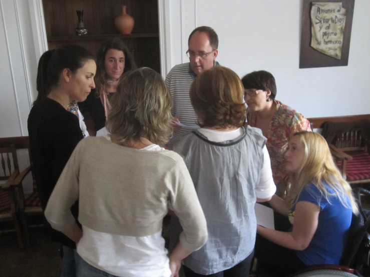 a group of people gathered around in a room