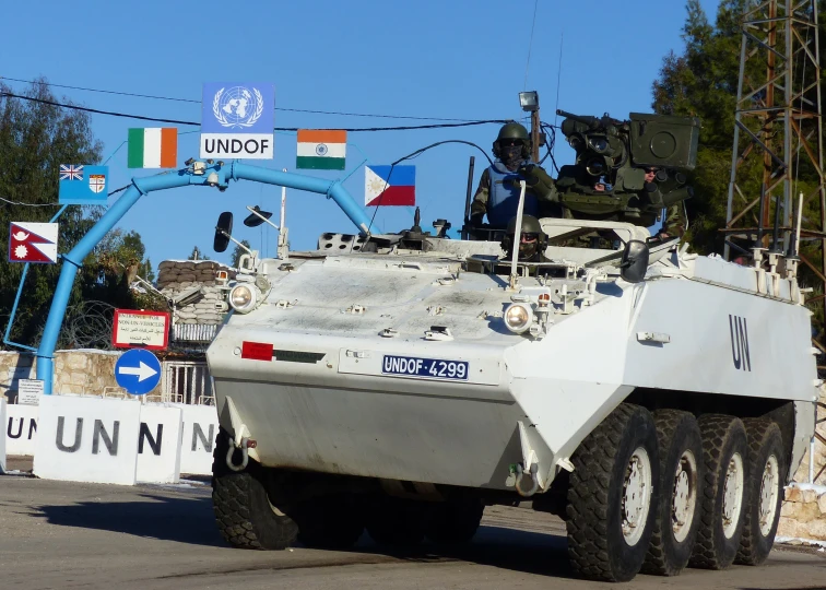 the united states army tank drives on a road