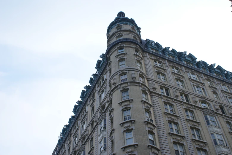 the building is beige and features many steeples