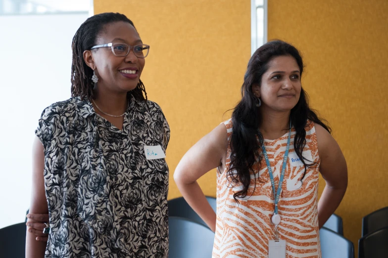 two women are standing near one another