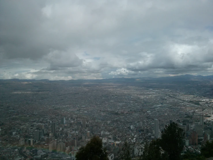 the view over a city from atop a hill