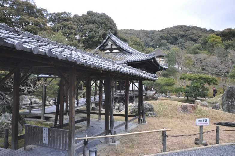 an area with several pavilions and trees in the background