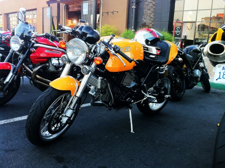 a bunch of motorcycles are parked in a lot