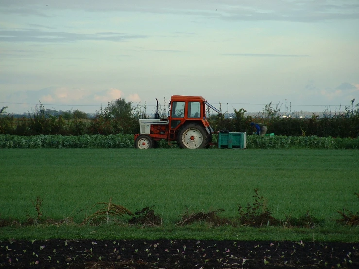 a tractor sitting in the middle of a field