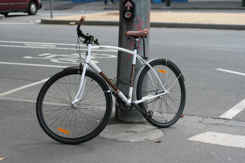 there is a bicycle parked in the street