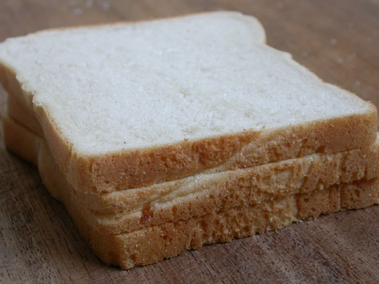 three slices of bread sitting next to each other on a table