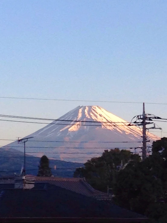 a view of a snow covered mountain from the town side