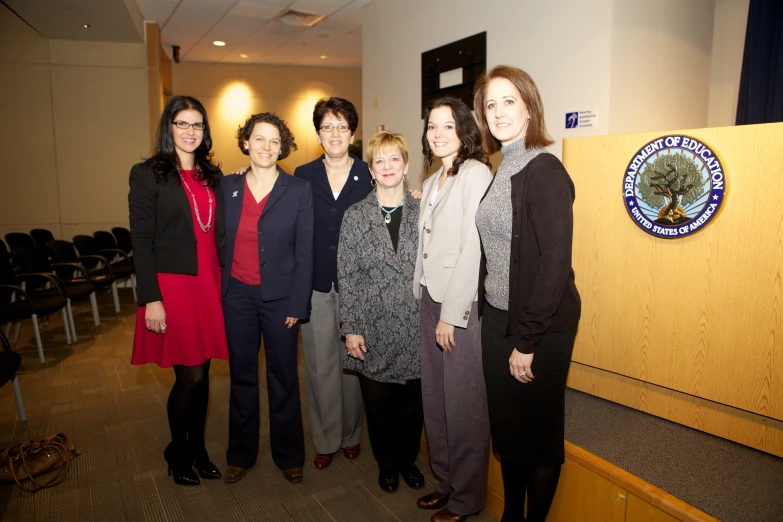 six women standing in front of the press room