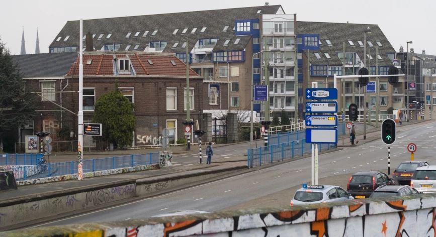 a road scene with traffic and some buildings