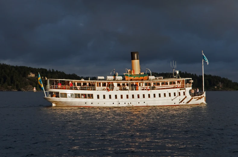 a large white boat on a body of water