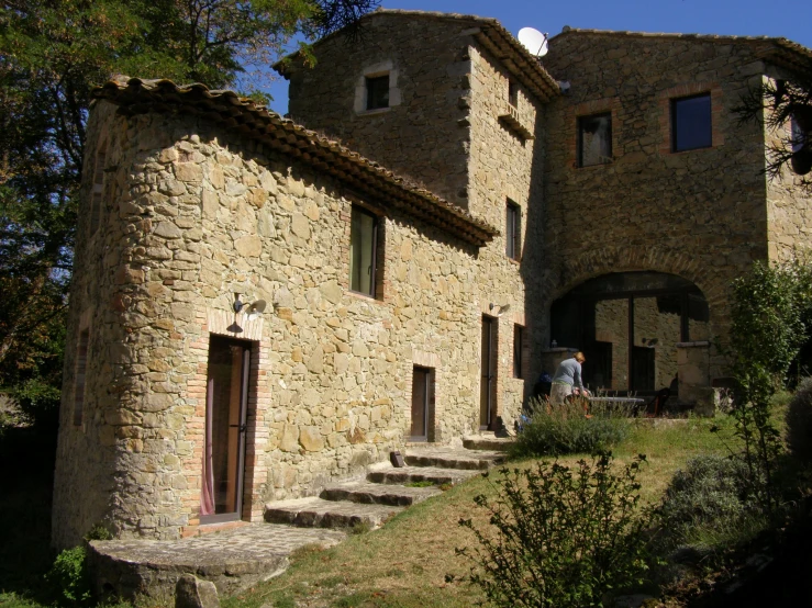 a stone house with stone steps leading to it