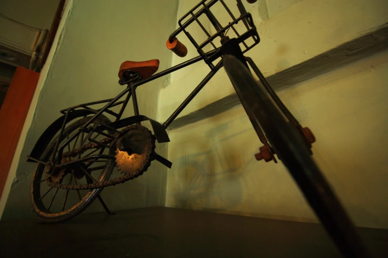 a bicycle leaning against a wall next to an electrical box