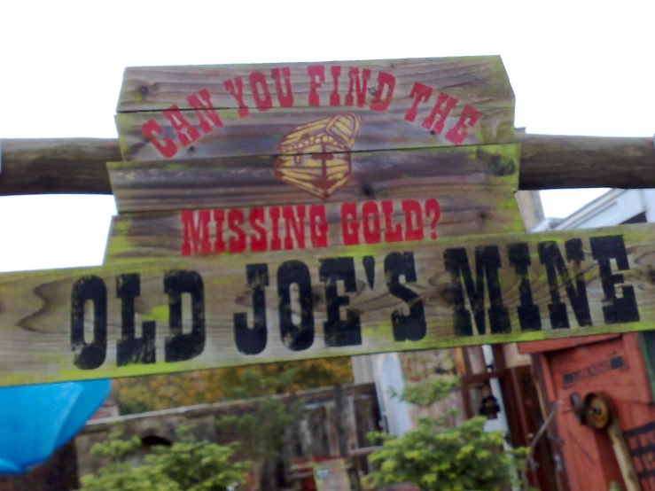 the wooden signs say old joe's mine and one is missing gold