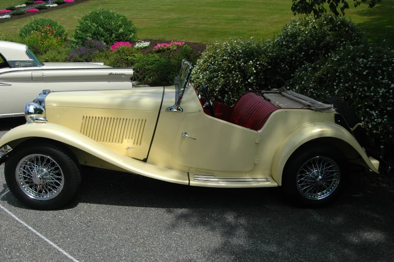 a classic car is shown parked on the street