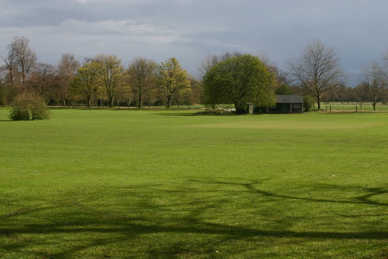 a lonely hut in a large open field