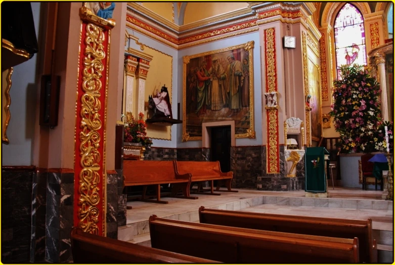 inside of an old church with the alter and pews