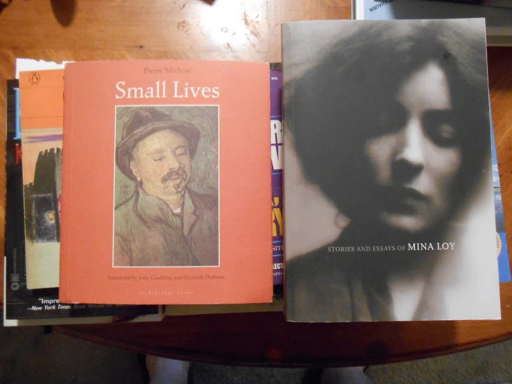 two book about small lives, one on the right and one on the right