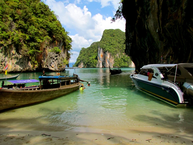 a number of boats on a body of water