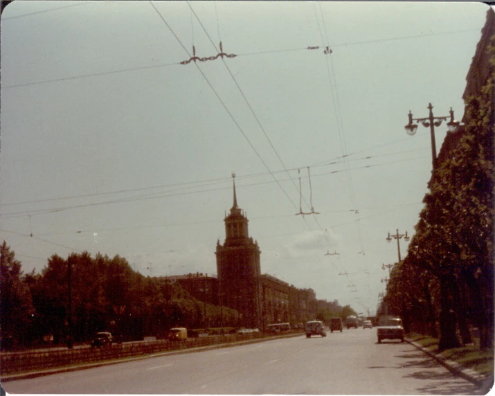 a view of traffic going uphill in a town