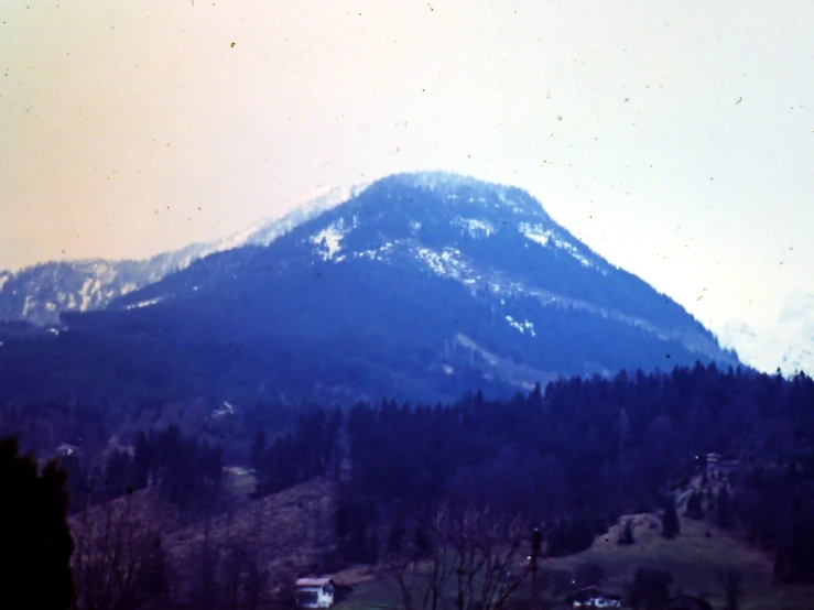 mountain surrounded by wooded hills and trees