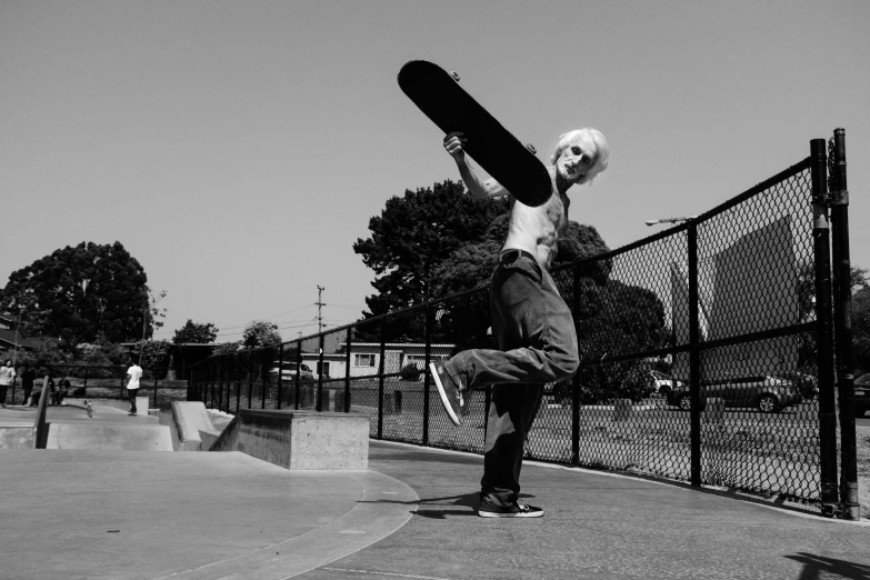 a young man is practicing his tricks on a skateboard