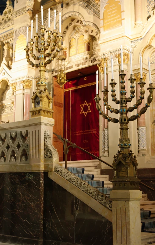 a gold and red chandelier in a church