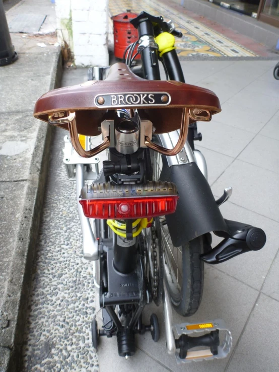 a motor cycle with a saddle on the back