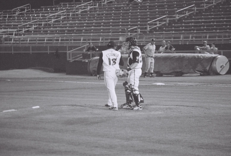 a black and white po of a player in the baseball game