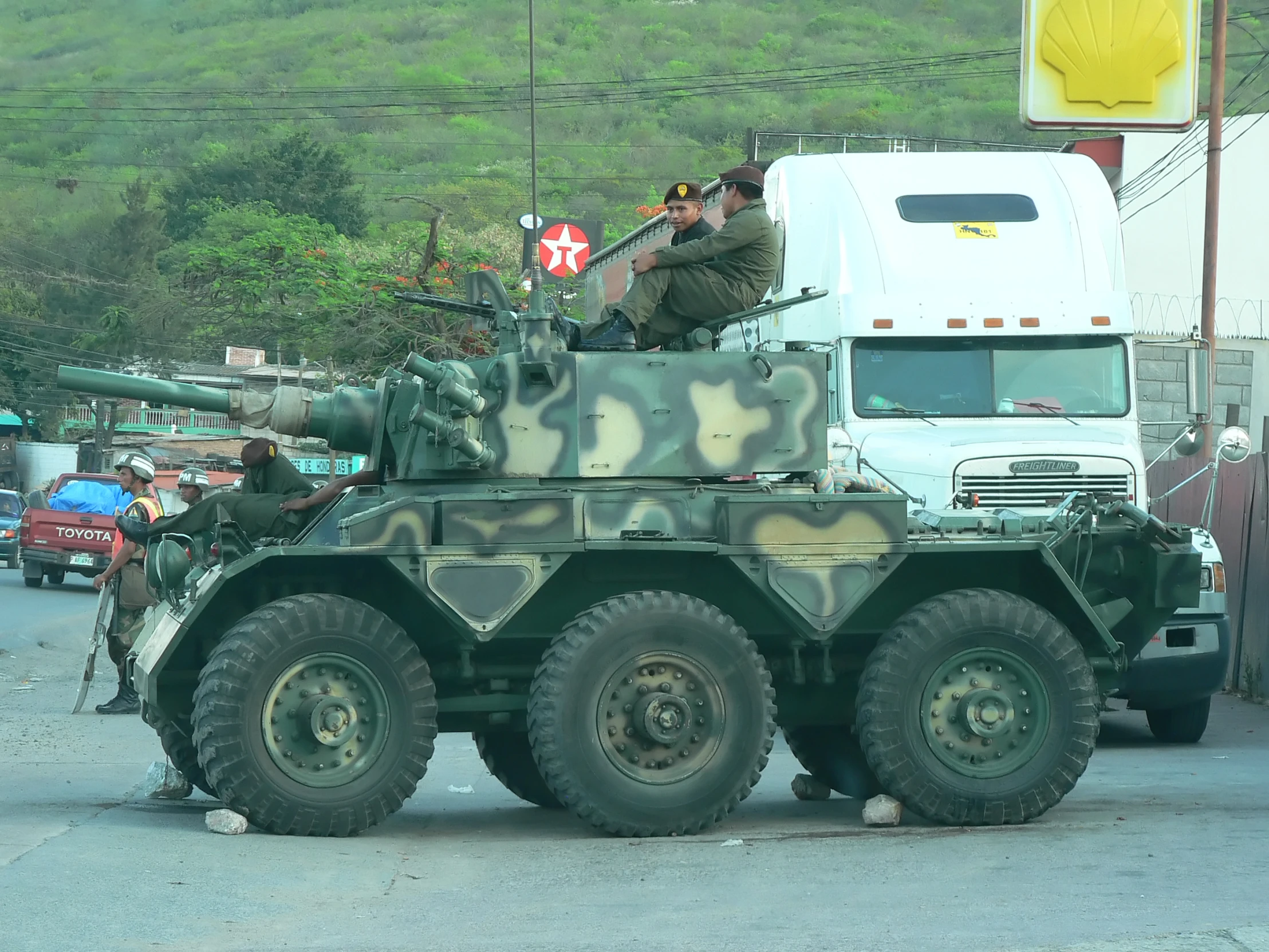 a military vehicle that is sitting in the street