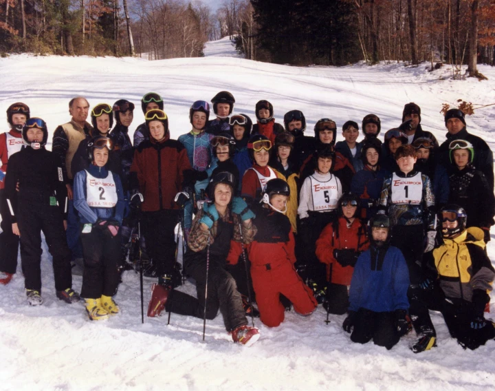 a group po of a skiing team and their coaches