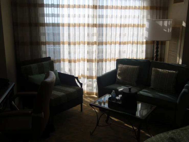 the curtains behind the couch are drawn diagonally