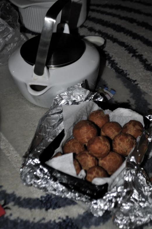 a basket full of food sitting on the floor next to a machine