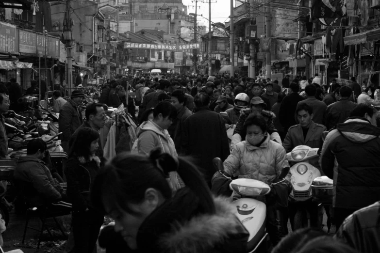 a large group of people are in the street together