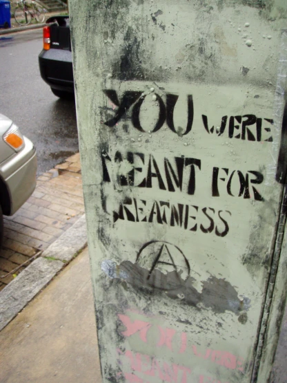 a sign posted on a post that reads, you were meant for seams