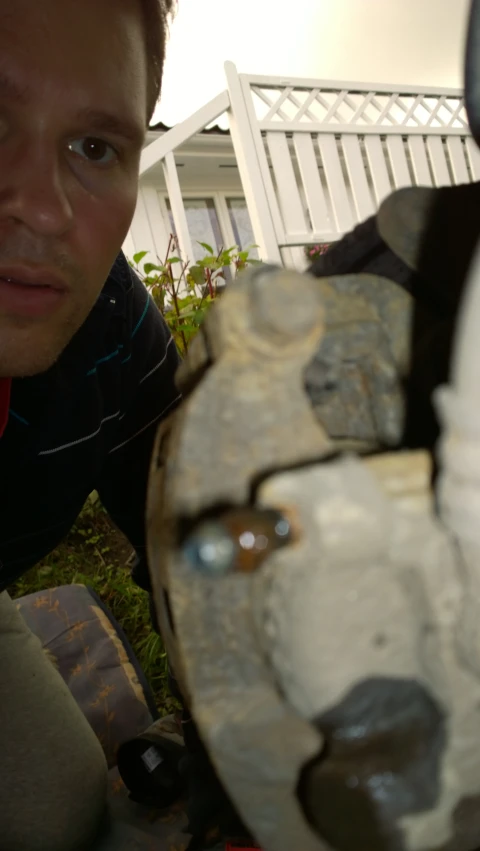 a man is looking at the inside of his motorcycle